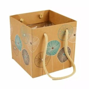 Sac kraft vert avec anses en corde pour emballage floral et présentation bouquets fleuriste