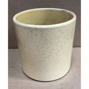 Cache-pot cylindrique en céramique émaillée beige moucheté pour orchidée en boutique de fleuriste