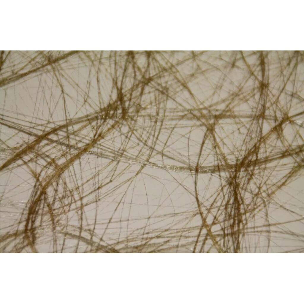 Rouleau de fibre ajourée métallisée or en voile de fils entrecroisés pour habiller les bouquets de Noël